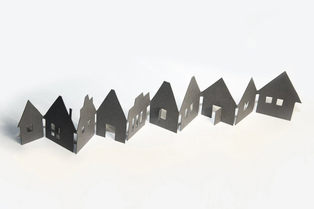 A bespoke cut estate agents brochure made to open up as a row of houses.