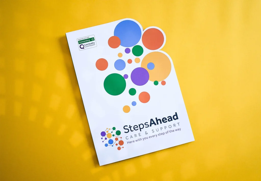 The front cover of a brochure made with a inventive approach using a bespoke die-cut shape to accentuate the branding.