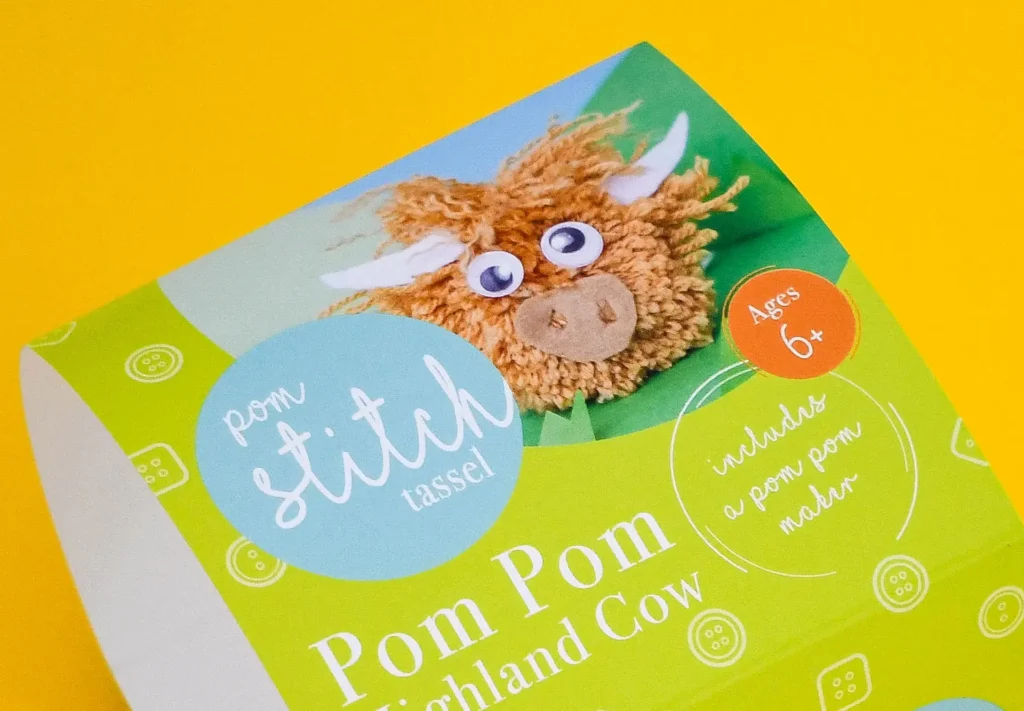 A close-up view of packaging printed for a food company, featuring fun branding.