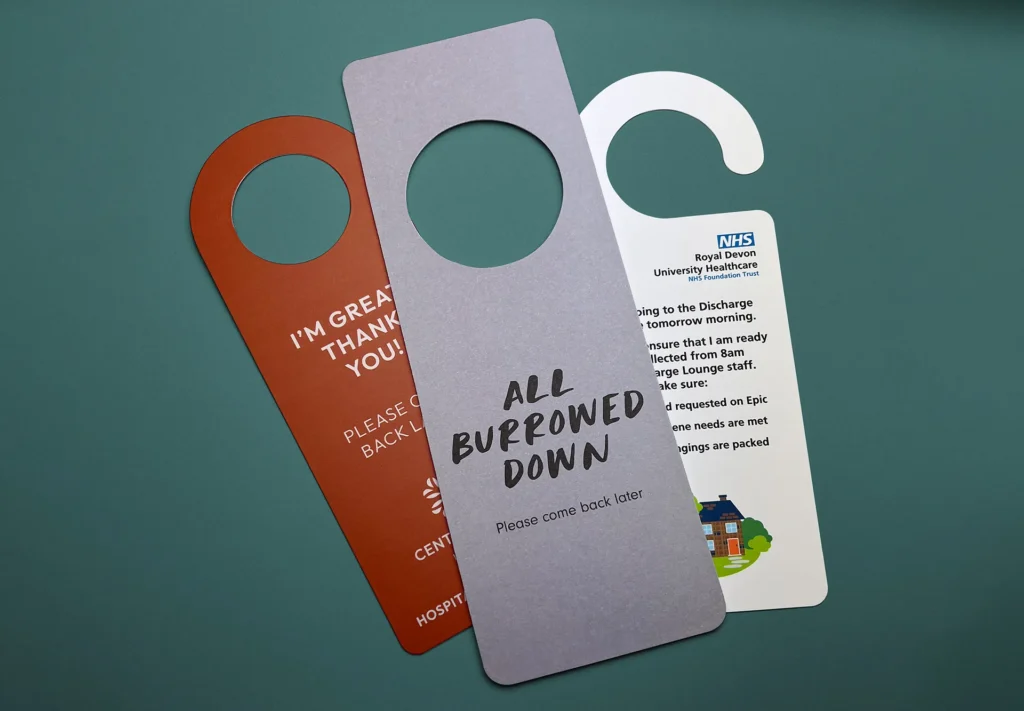 A collection of high-quality door hangers printed for hotels.