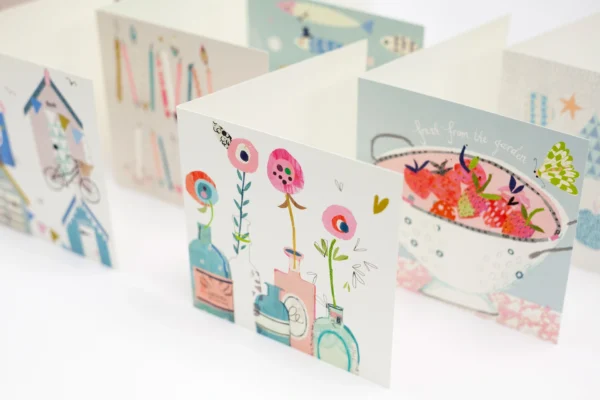 Light coloured, beautifully printed greeting cards with various custom designs.