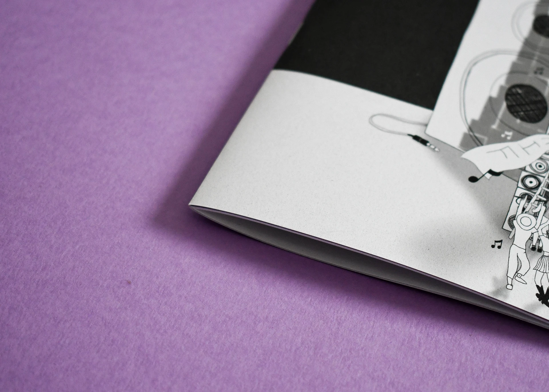 Close up of booklet edge showing clean binding and smooth paper finish from professional digital printing