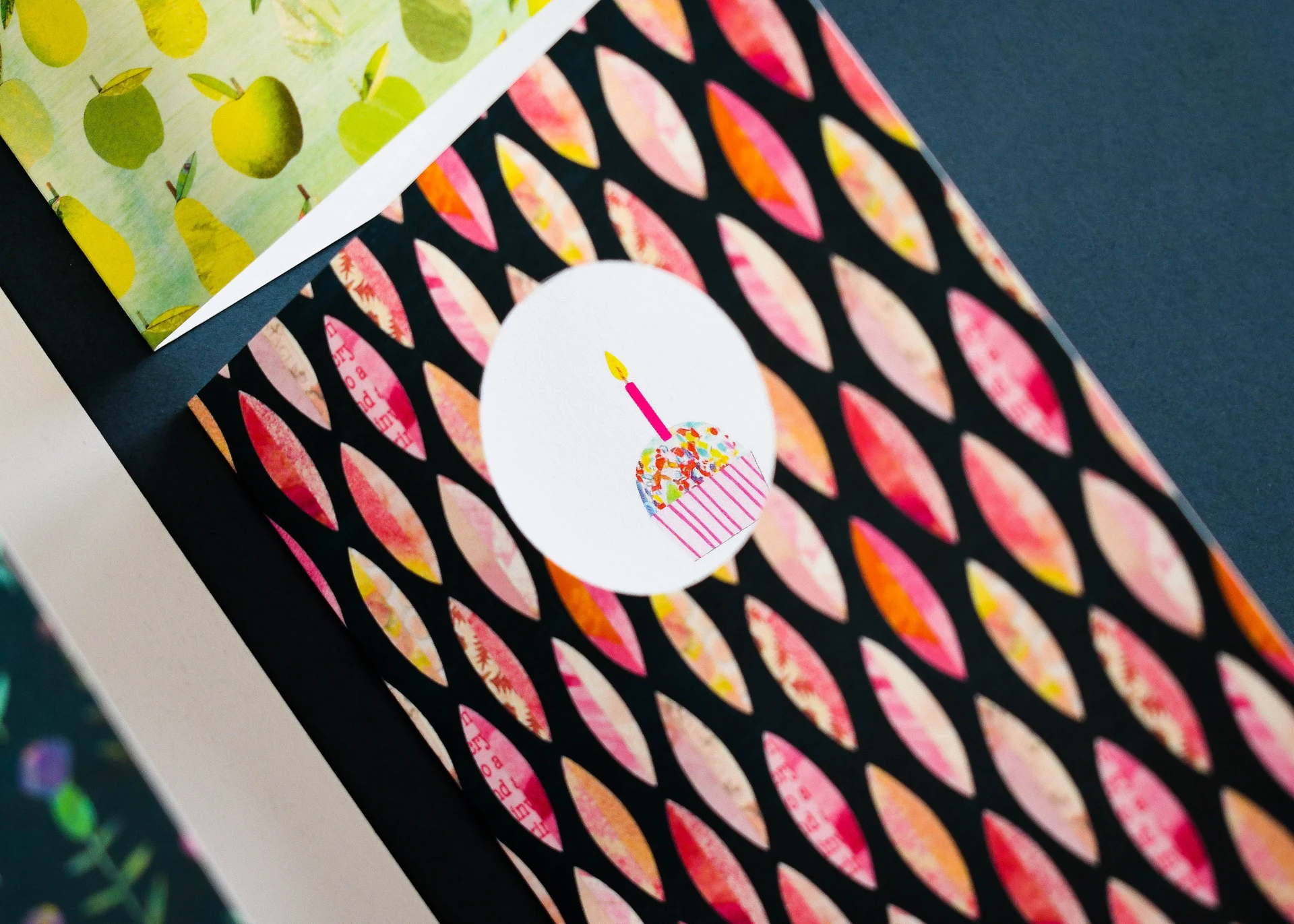 Creative greeting card with die cut window and colourful printed pattern demonstrating precision digital print and finishing