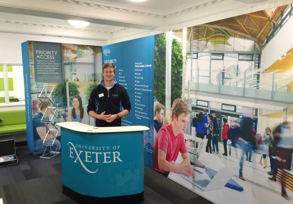 A large exhibition stand back wall and podium.