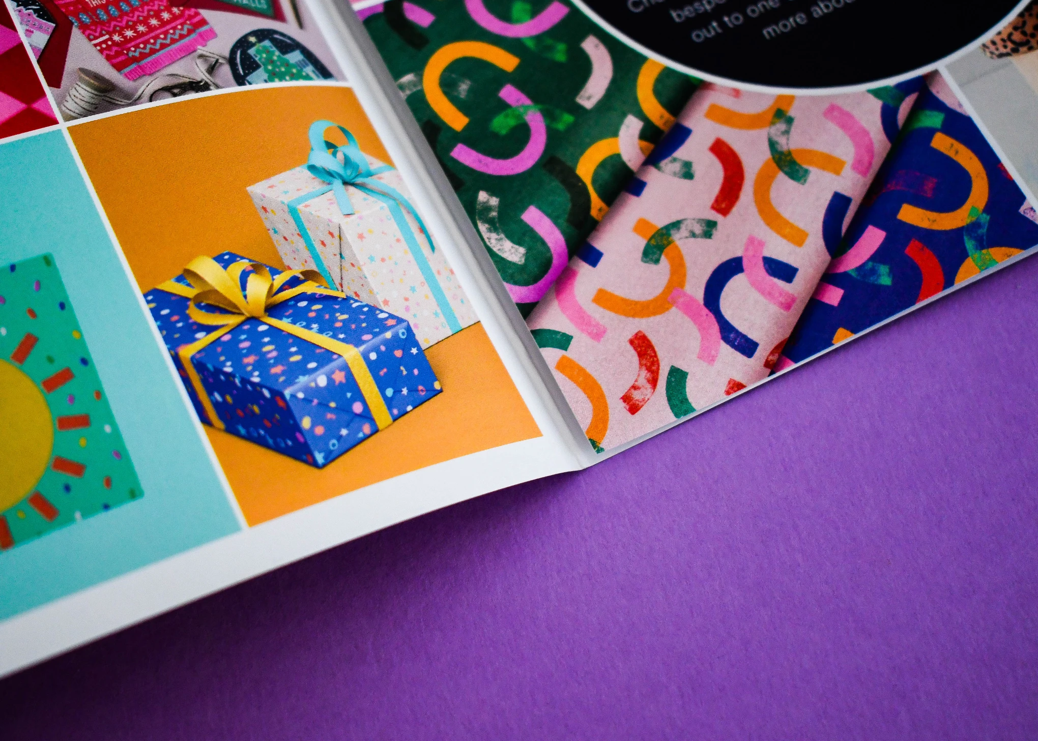 Product brochure opened to a spread of gift wrap and wrapping paper designs.