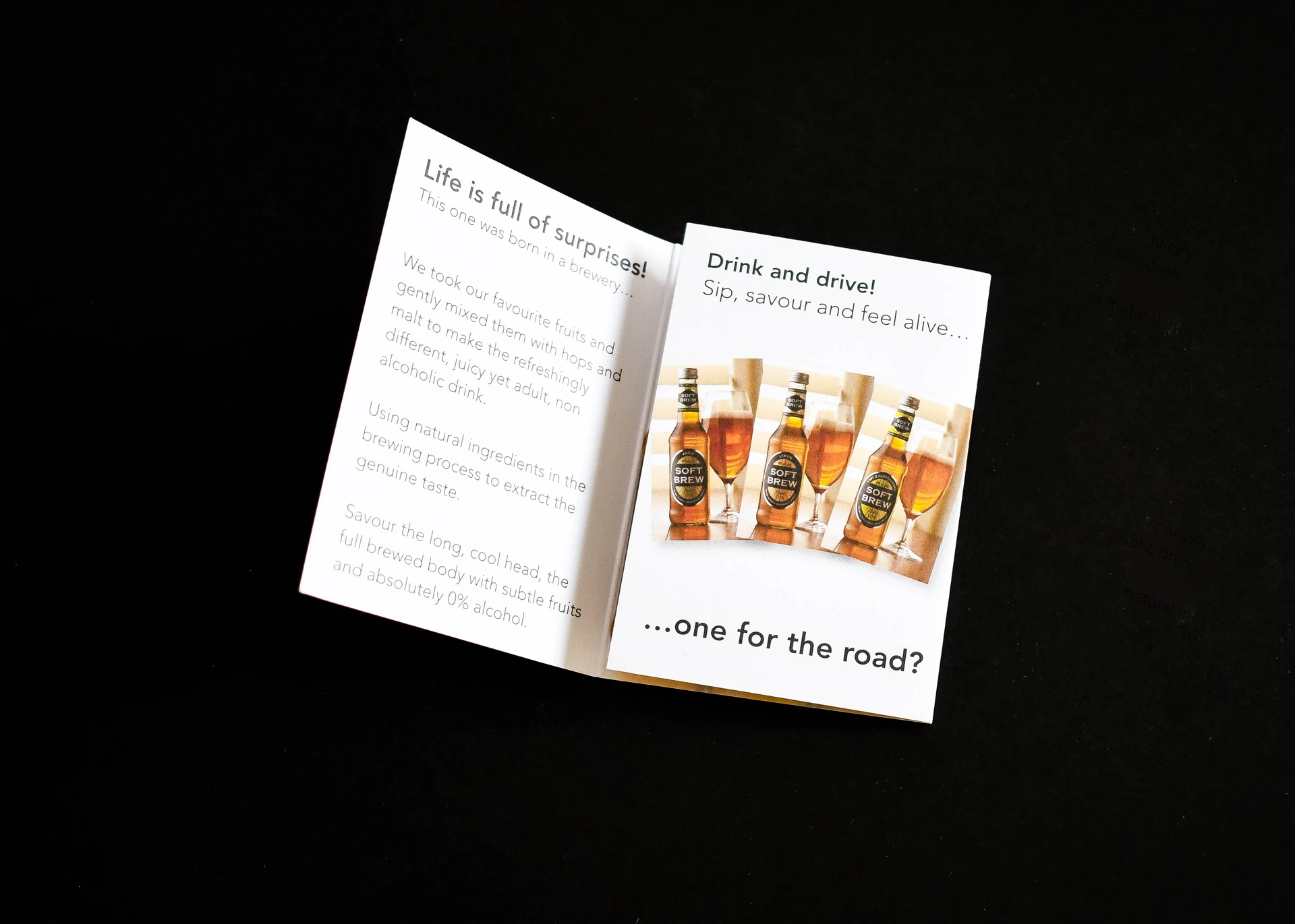 A small Soft Brew booklet open on black, with product photography facing the copy page.