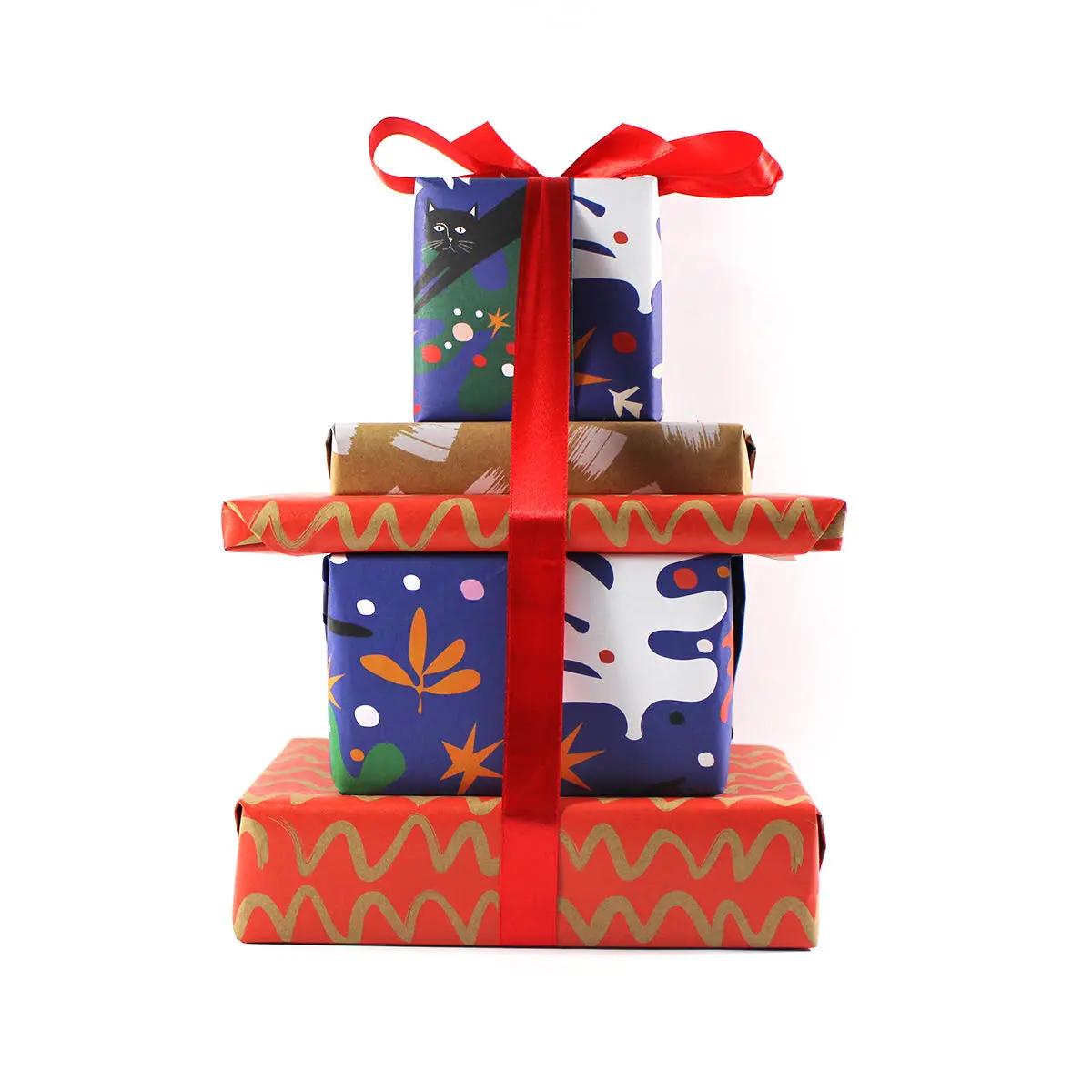 A stack of four gift-wrapped presents in different Christmas wrapping paper designs (a cat and tree print, an abstract white and navy pattern, plain kraft brown, and red with a gold wavy line pattern), tied together with a red ribbon and bow, against a white background.
