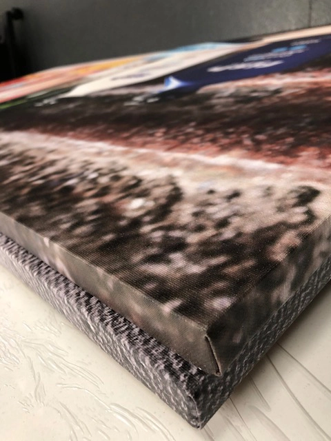 A close up of an art print on canvas.