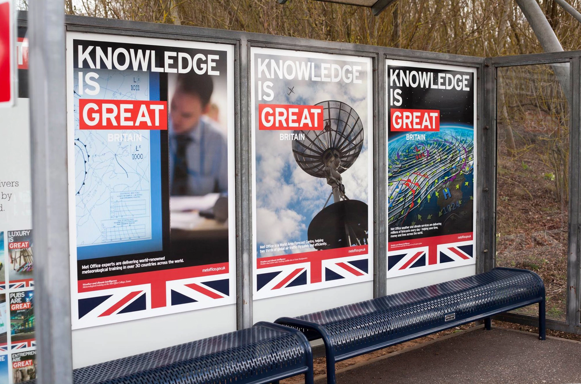 a row of three large custom printed posters