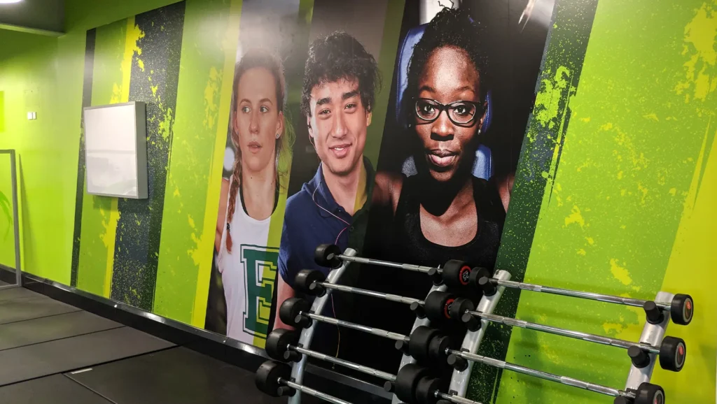A large print covering the wall of a gym.