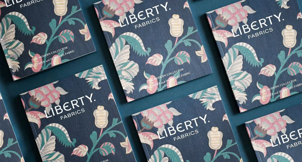 Several Liberty Fabric brochures organised in a neat grid.