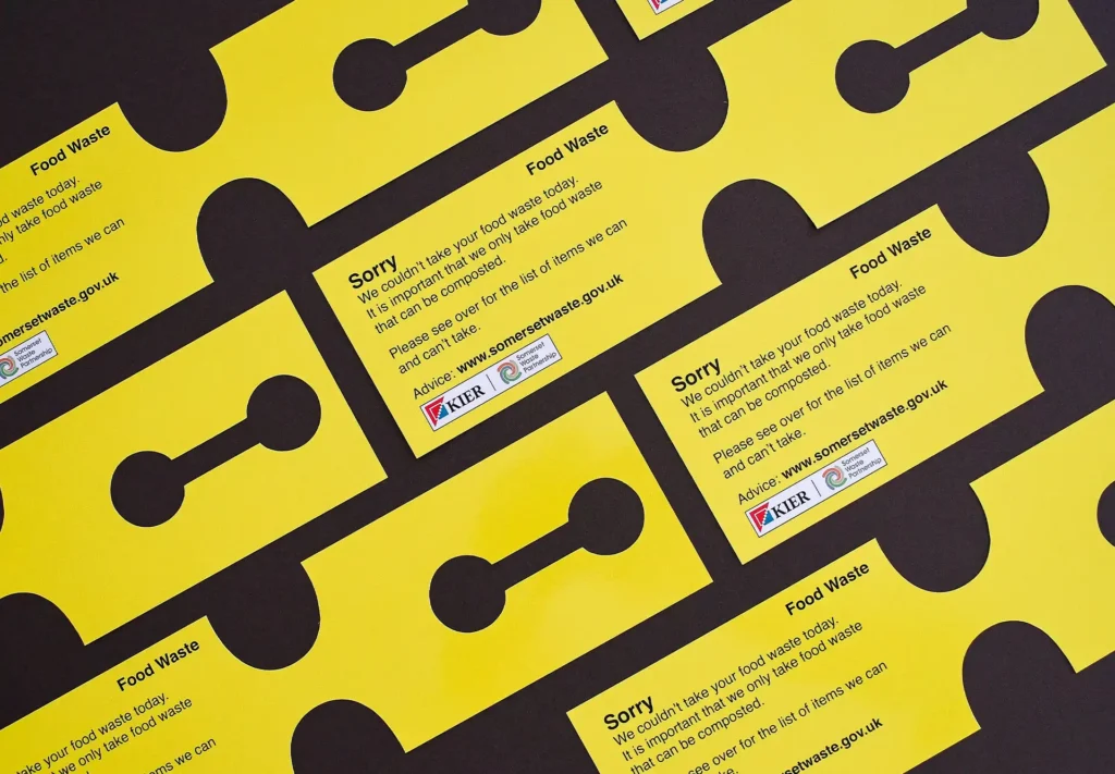 Bespoke printed die-cut labels designed for food waste bins, serving as notifications to homeowners that their waste is non-compostable and cannot be collected.