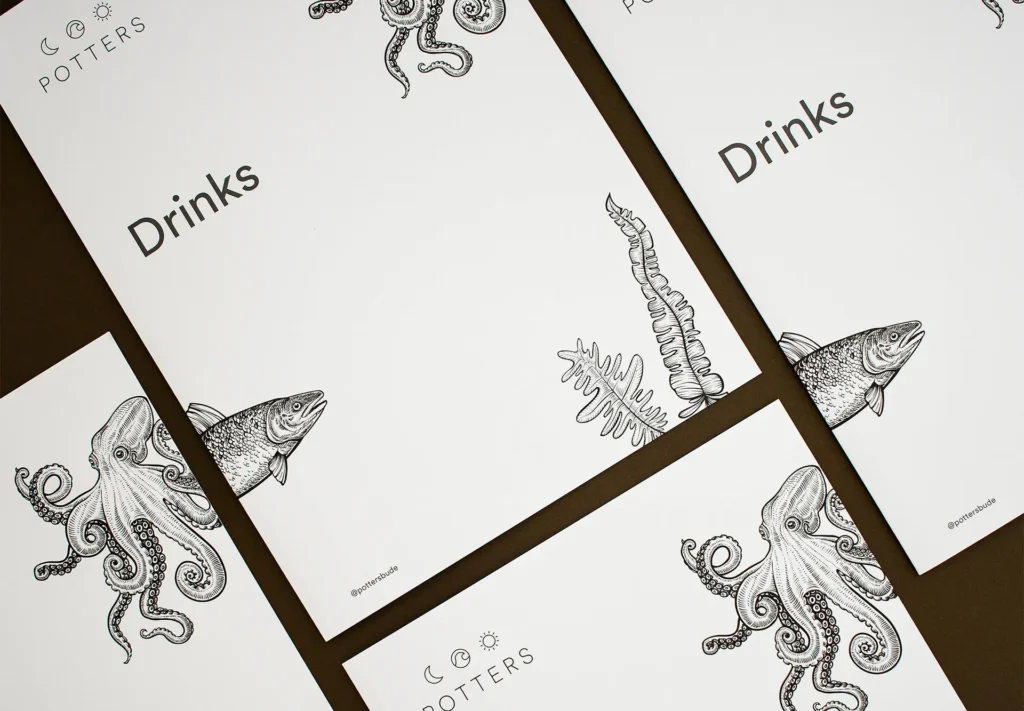 A selection of drinks menus featuring beautiful illustrations of sea creatures.