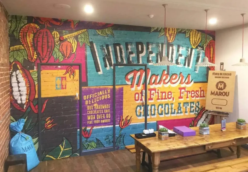 A full-wall graphic printed to enliven one side of a shop, adding vibrancy and visual interest to the space.