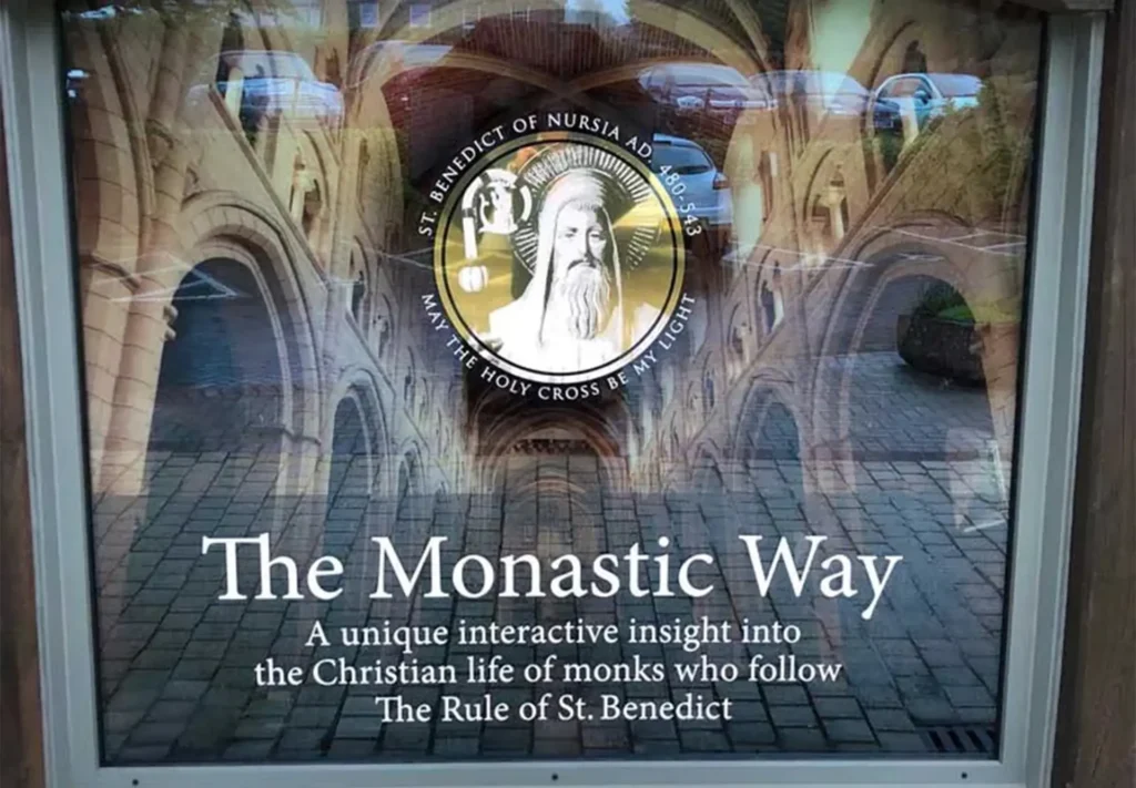 A highly detailed window vinyl featuring text and an image of a statue, adding sophistication and intrigue to the space.