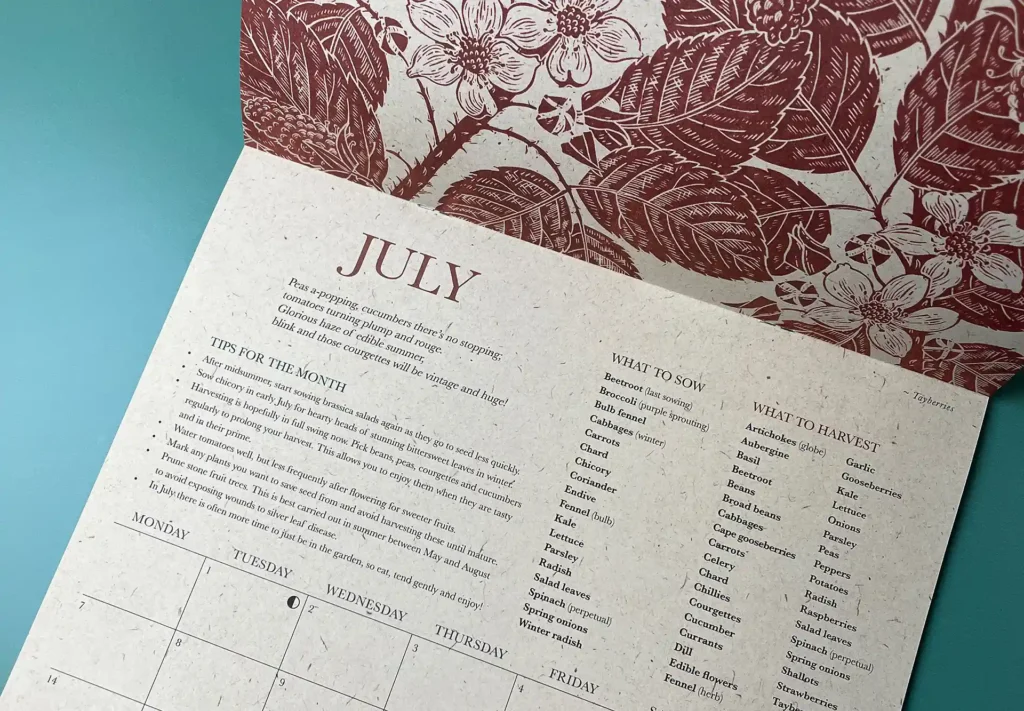 Close-up of the July page in a calendar, showing detailed date layout and sharp lithographic print quality.