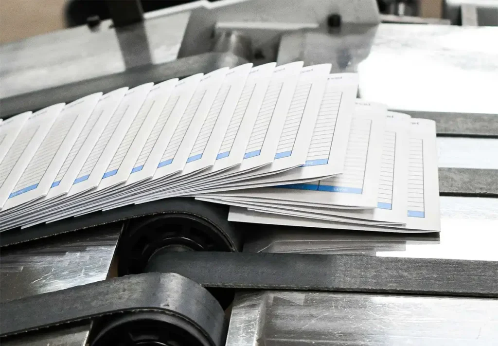 Magazines on the production line, ready for distribution.