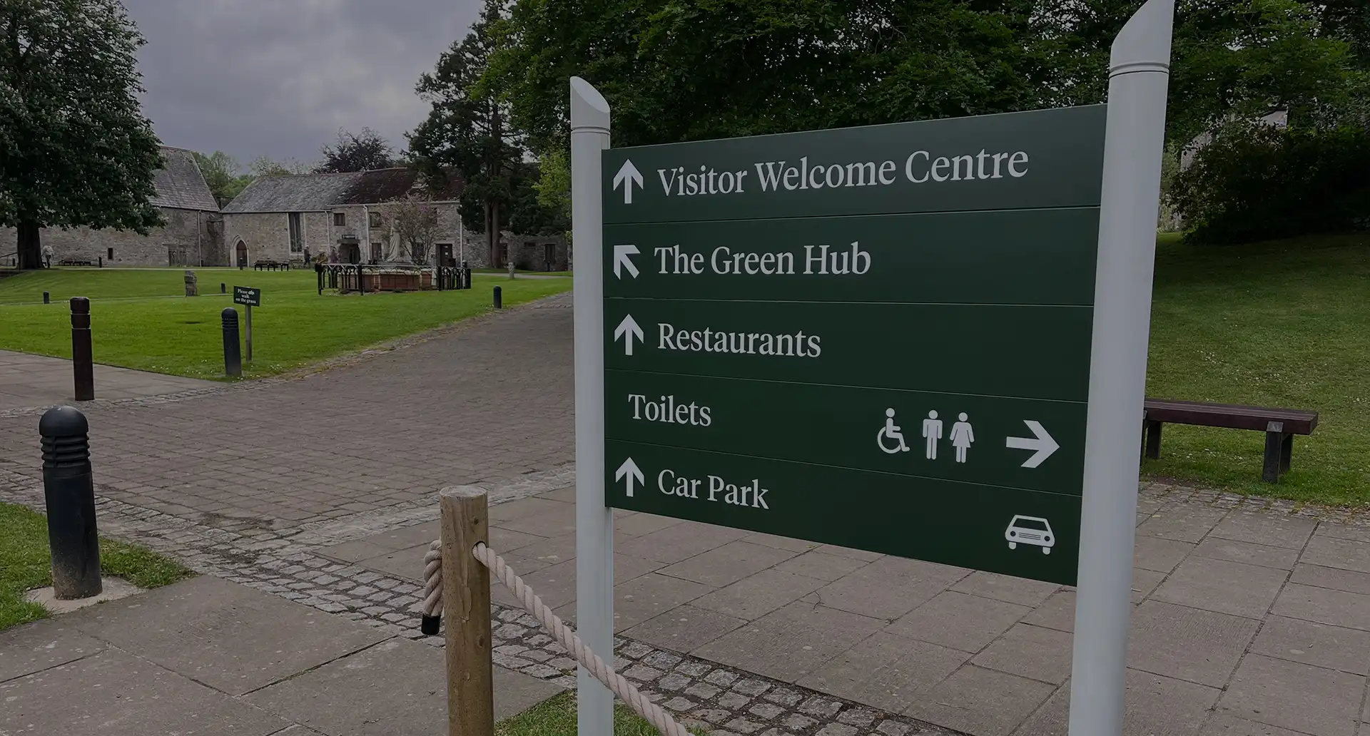 A set of directional signage with bold vinyl lettering, providing clear navigation in a modern space, ideal for offices, events, or public areas.