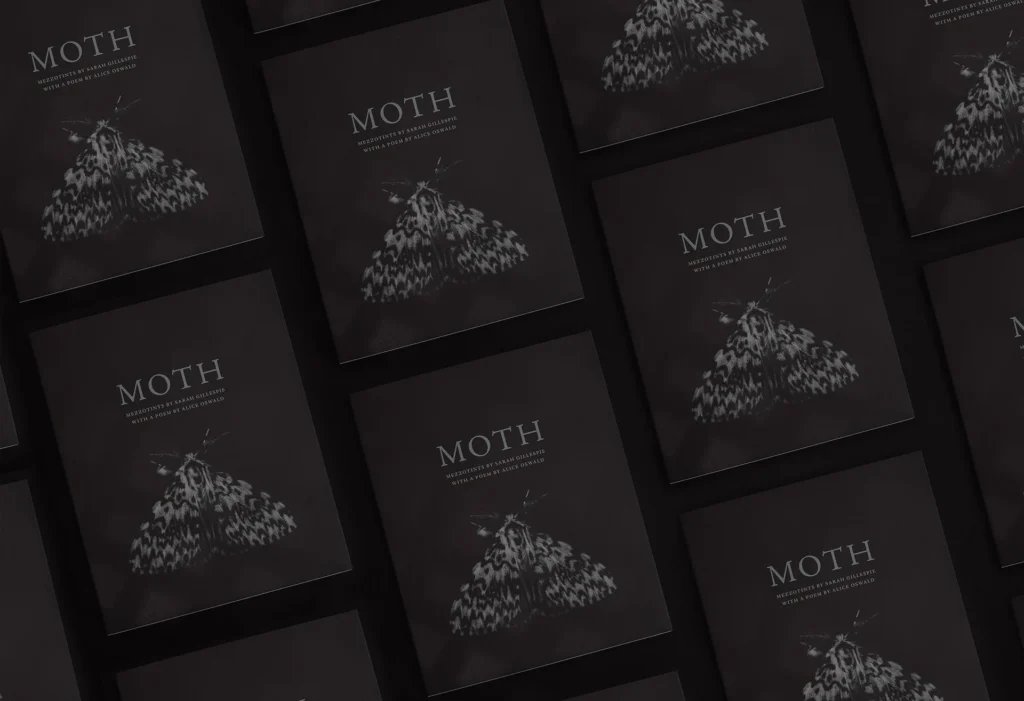 Several copies of a poetry book featuring a moth on the front cover.