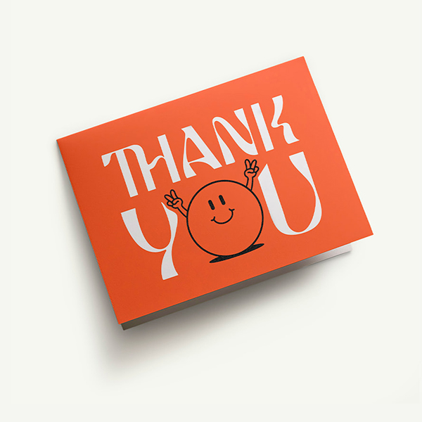 A bright, vibrant, high-quality folded thank you card.