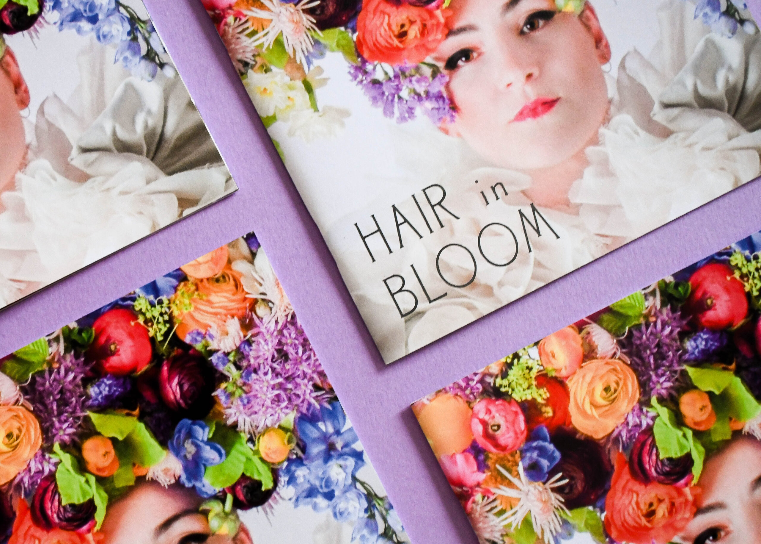 A layout of multiple Ashley house graphic designed and printed brochures on a purple background.