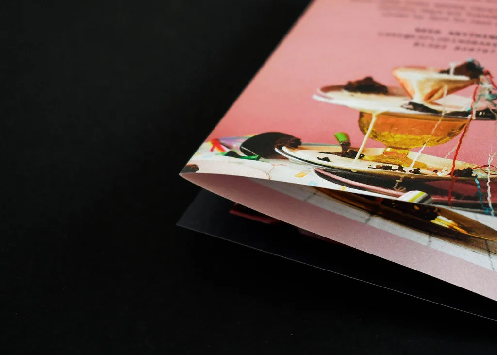 Close up of digitally printed leaflet fold showing paper quality and precise finishing