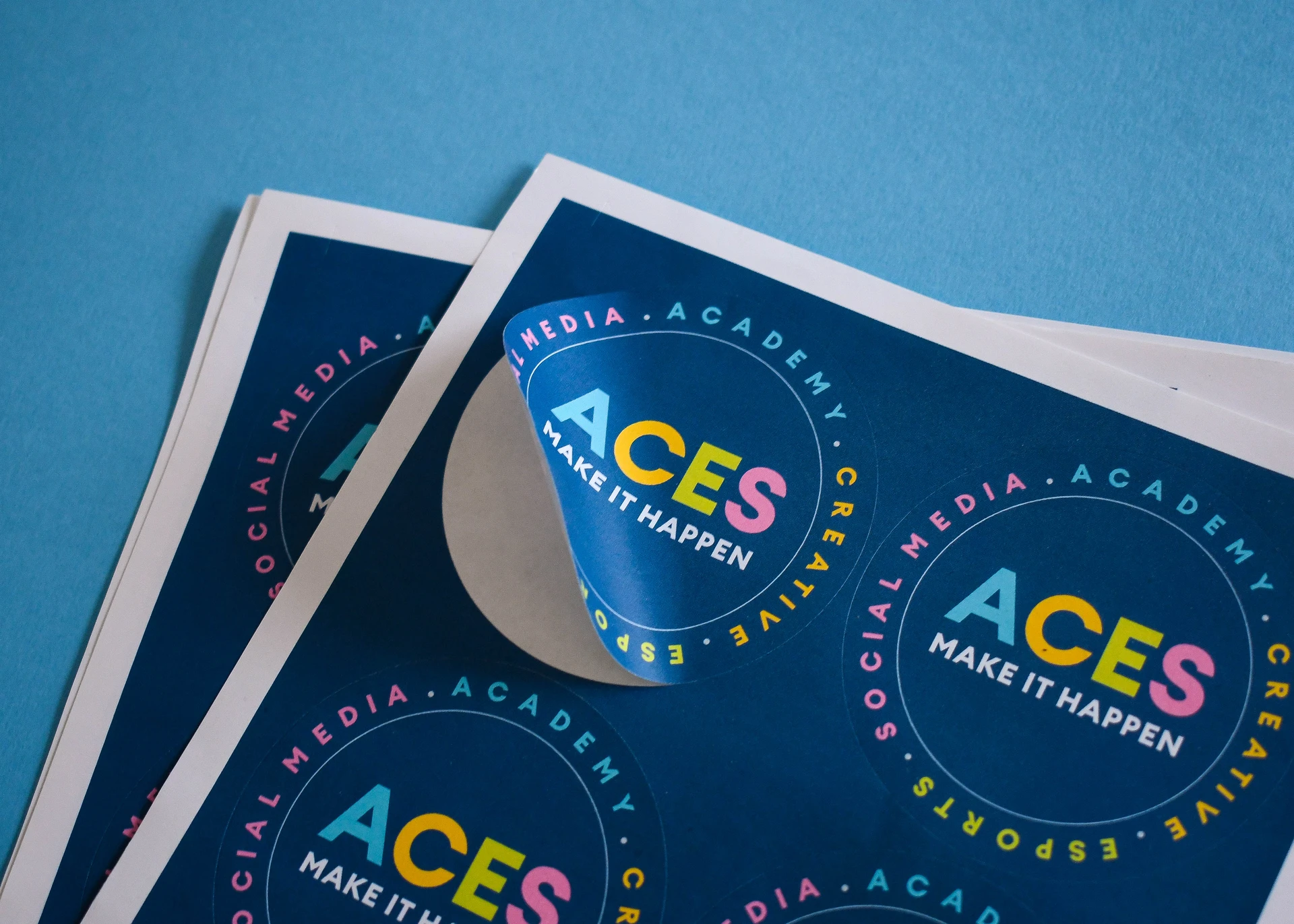 Digitally printed sticker sheets with peel detail showing colour accuracy and smooth finish