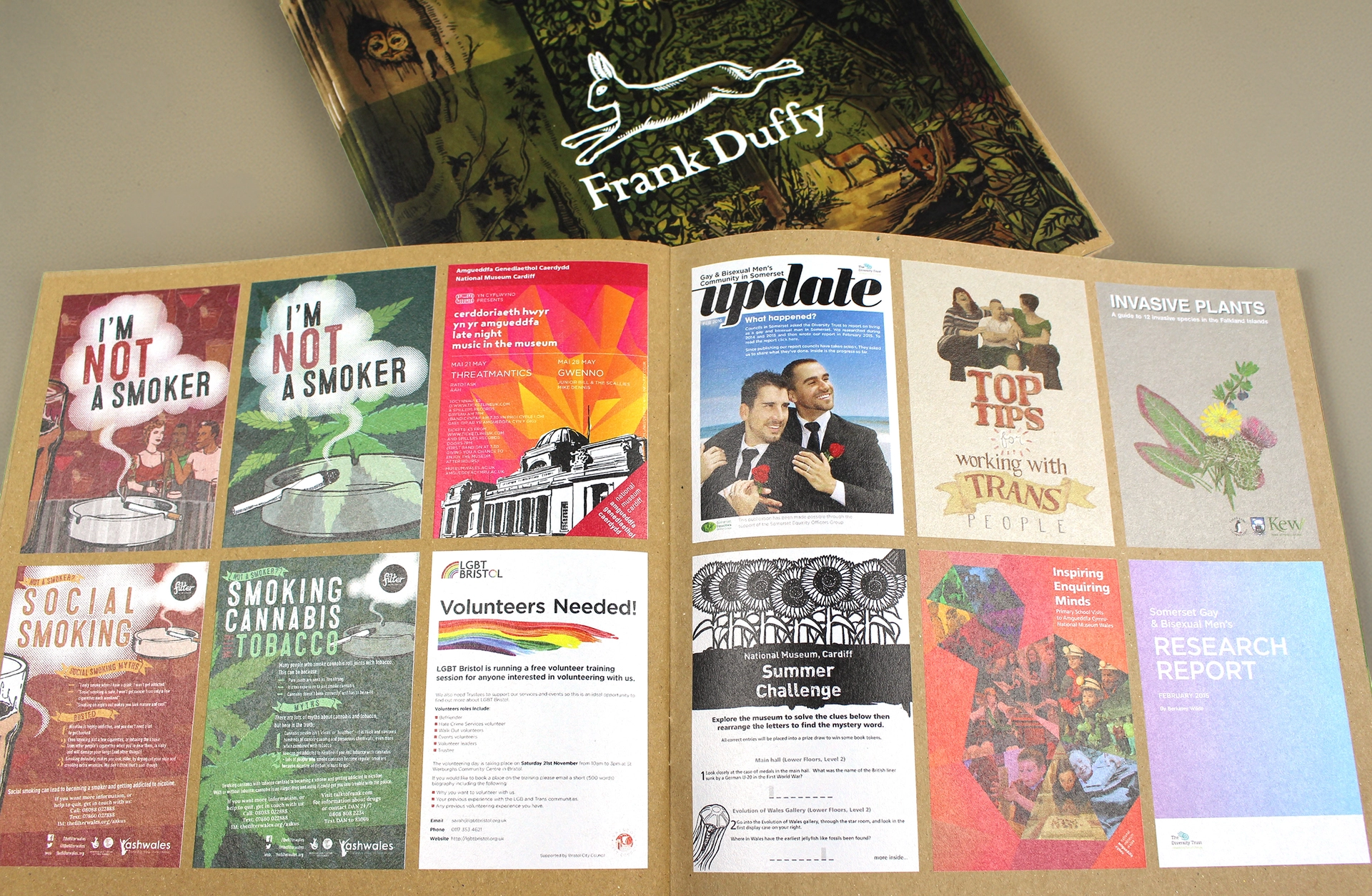 Open recycled paper brochure displaying printed campaign materials and sustainable print examples