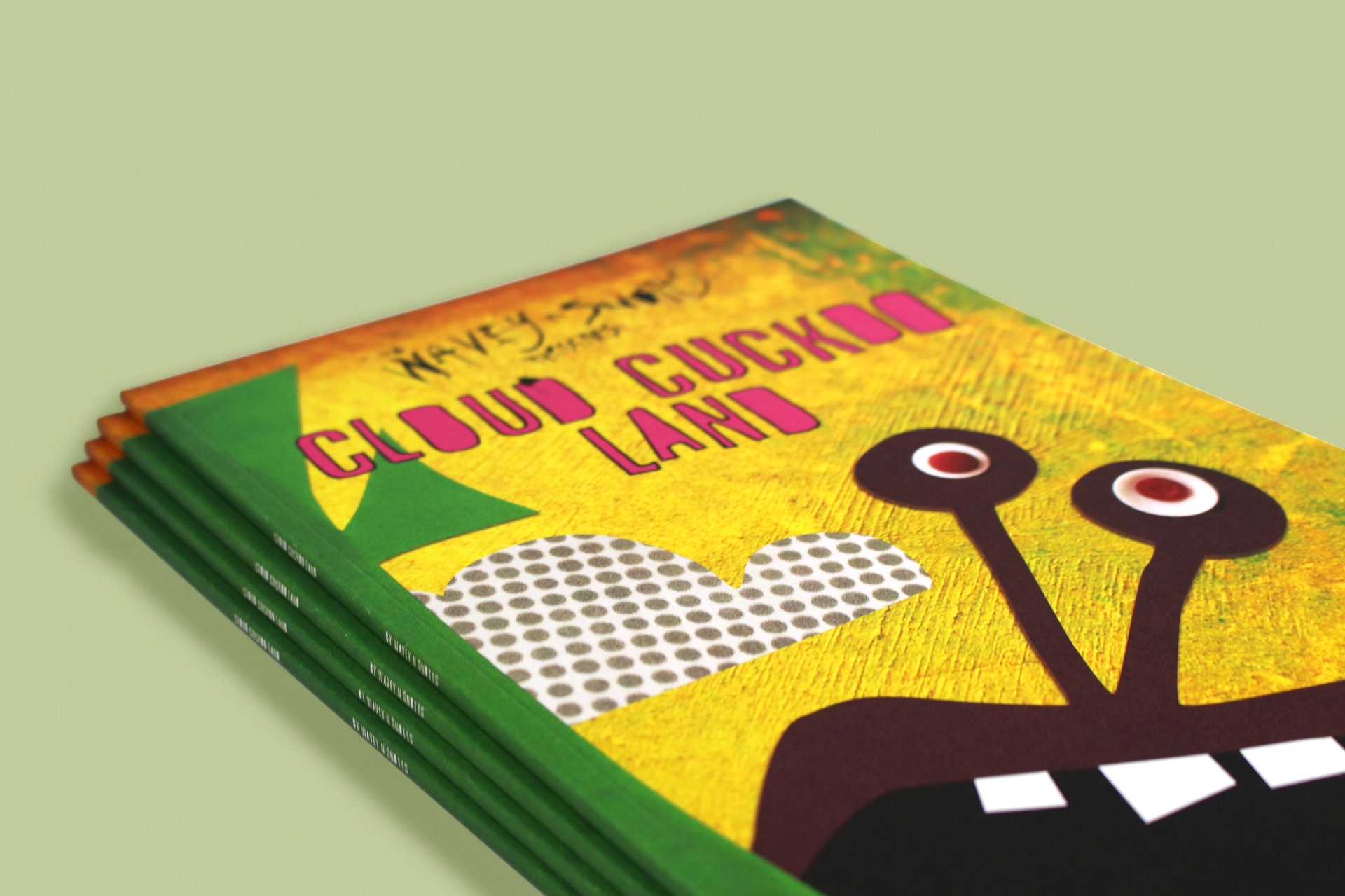Stack of Cuckoo Land printed booklets with colourful illustrated cover and green spine