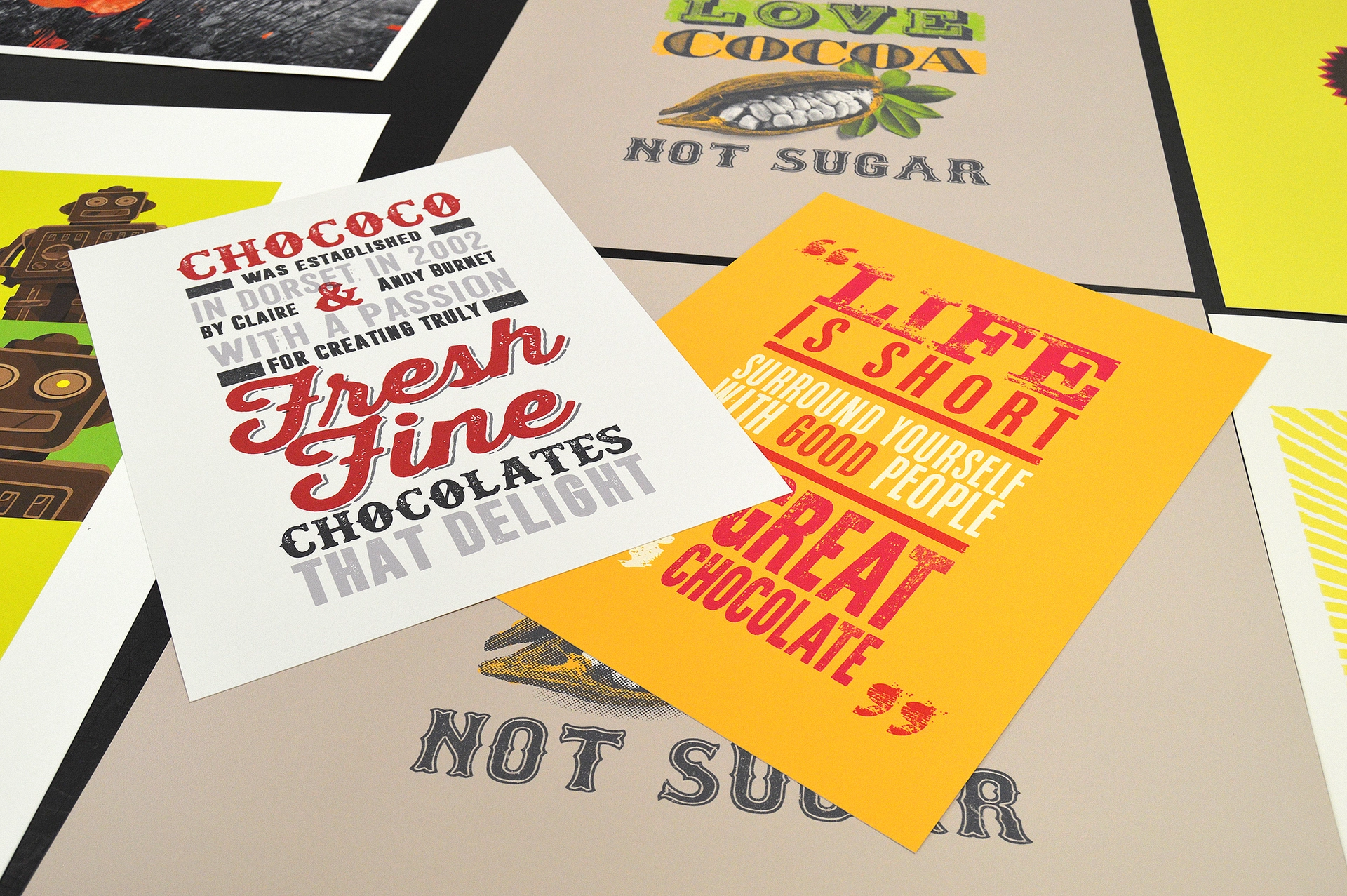 Colourful printed Chococo posters and cards showing bold typography and high quality eco-conscious print