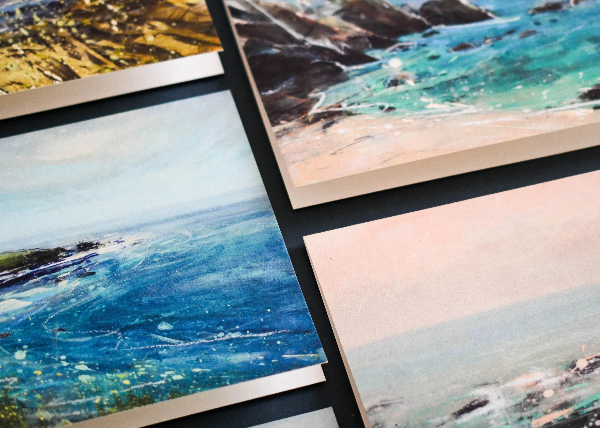 Printed greeting cards featuring coastal artwork and seascape illustrations