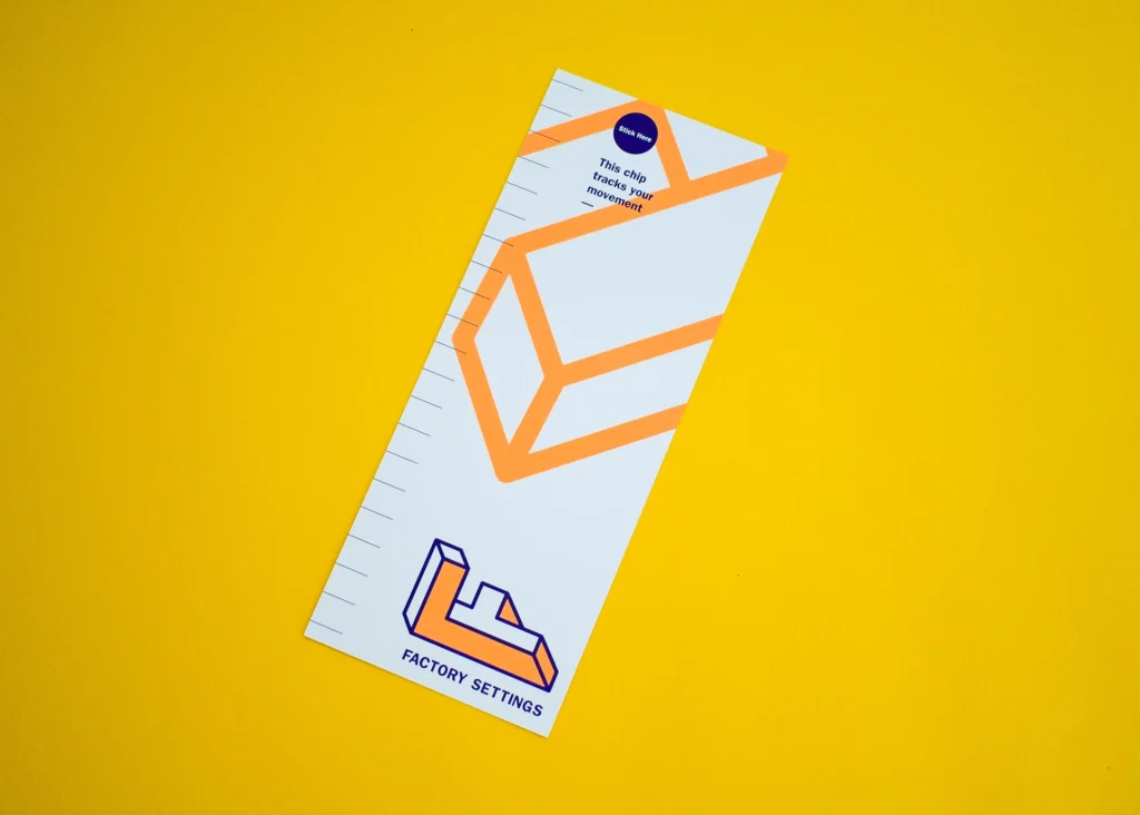 Printed movement-tracking leaflet with measurement markings, geometric graphics and a position for attaching a tracking chip