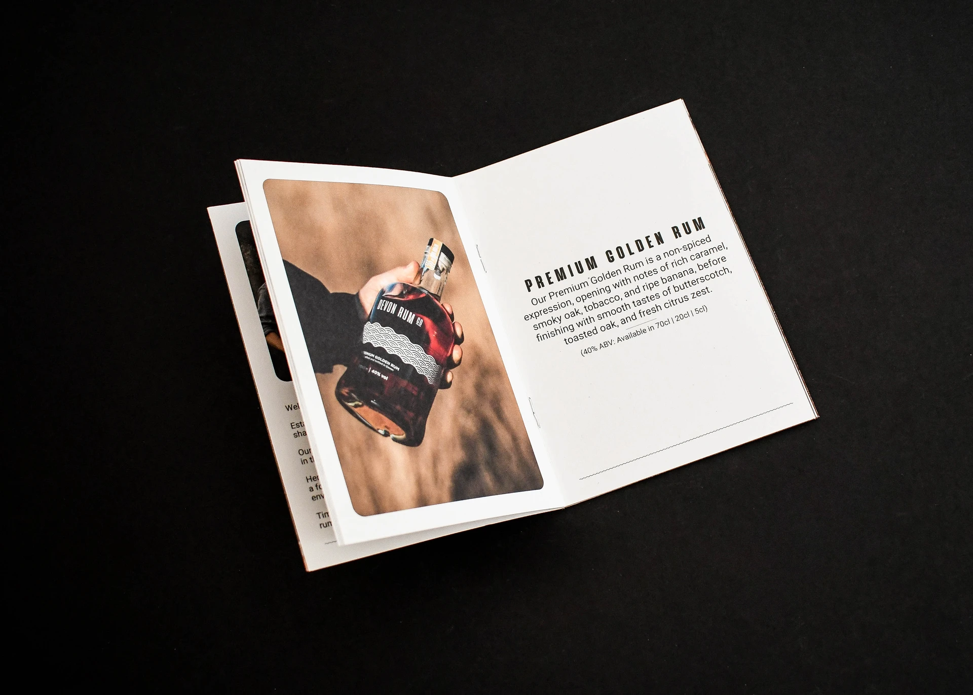 Open product leaflet featuring a bottle of premium golden rum with tasting notes