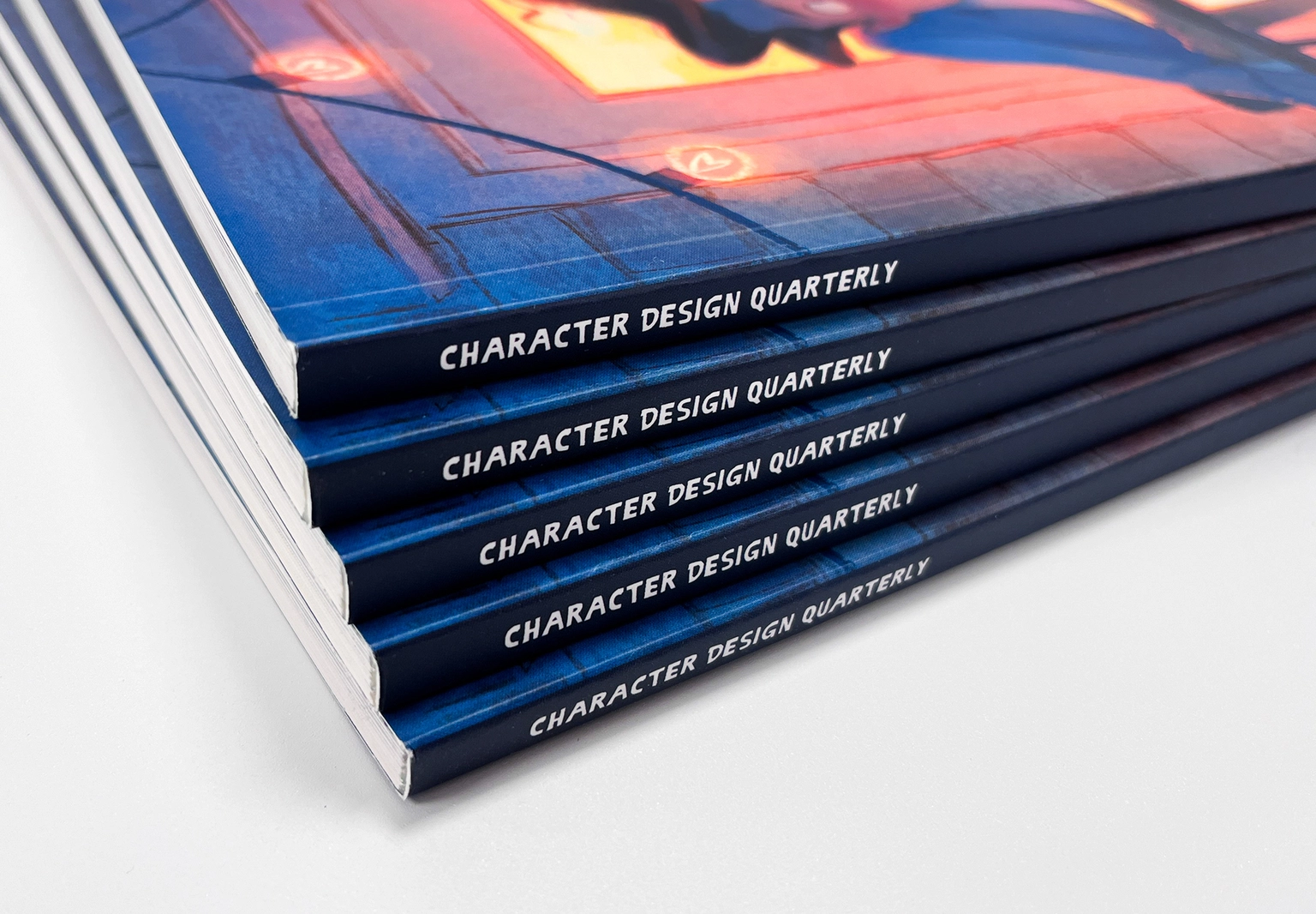 Stack of professionally printed magazines featuring PUR bound spines and square-backed premium magazine binding