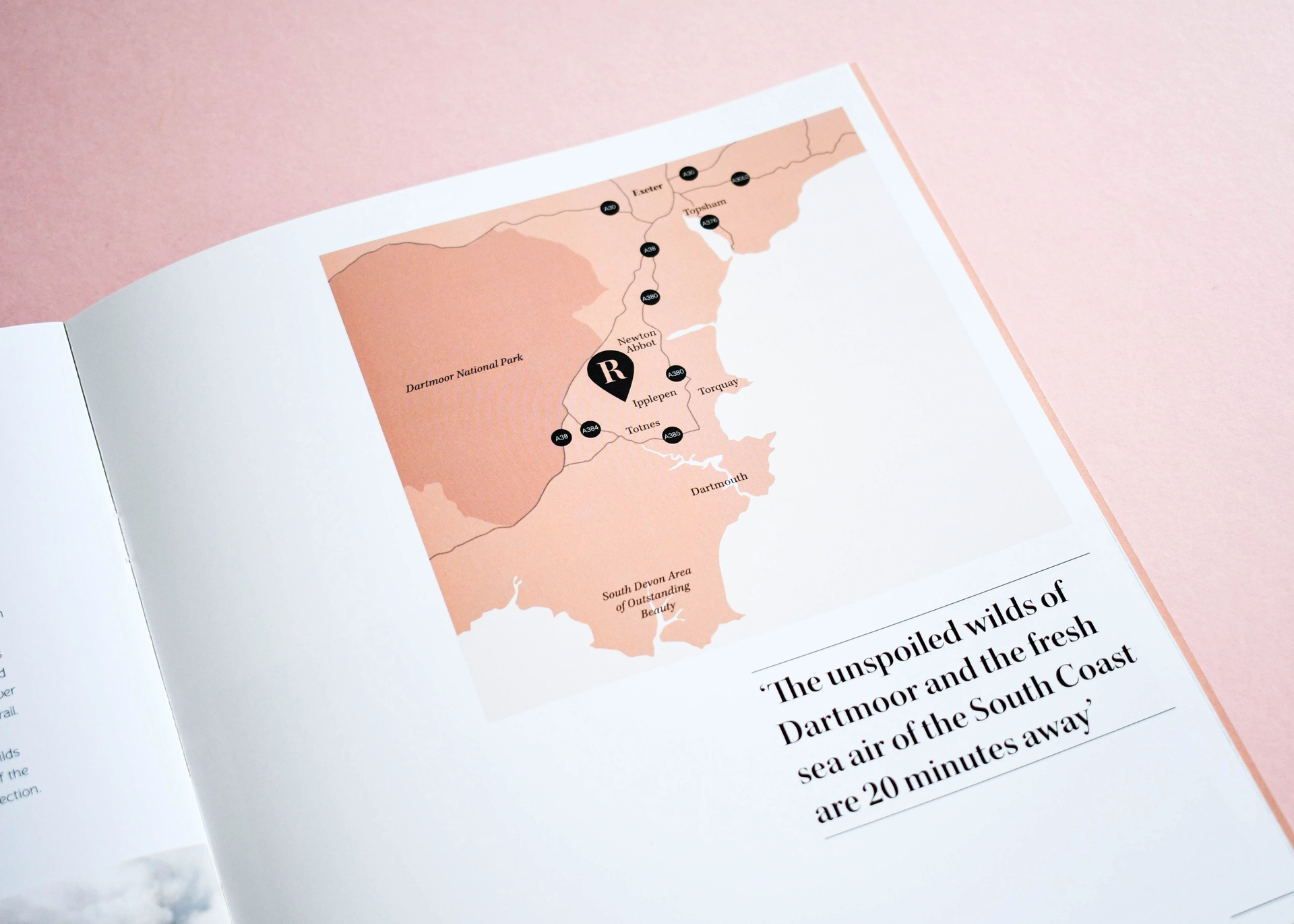 Printed spread with an illustrated location map and a pull quote set in serif type.