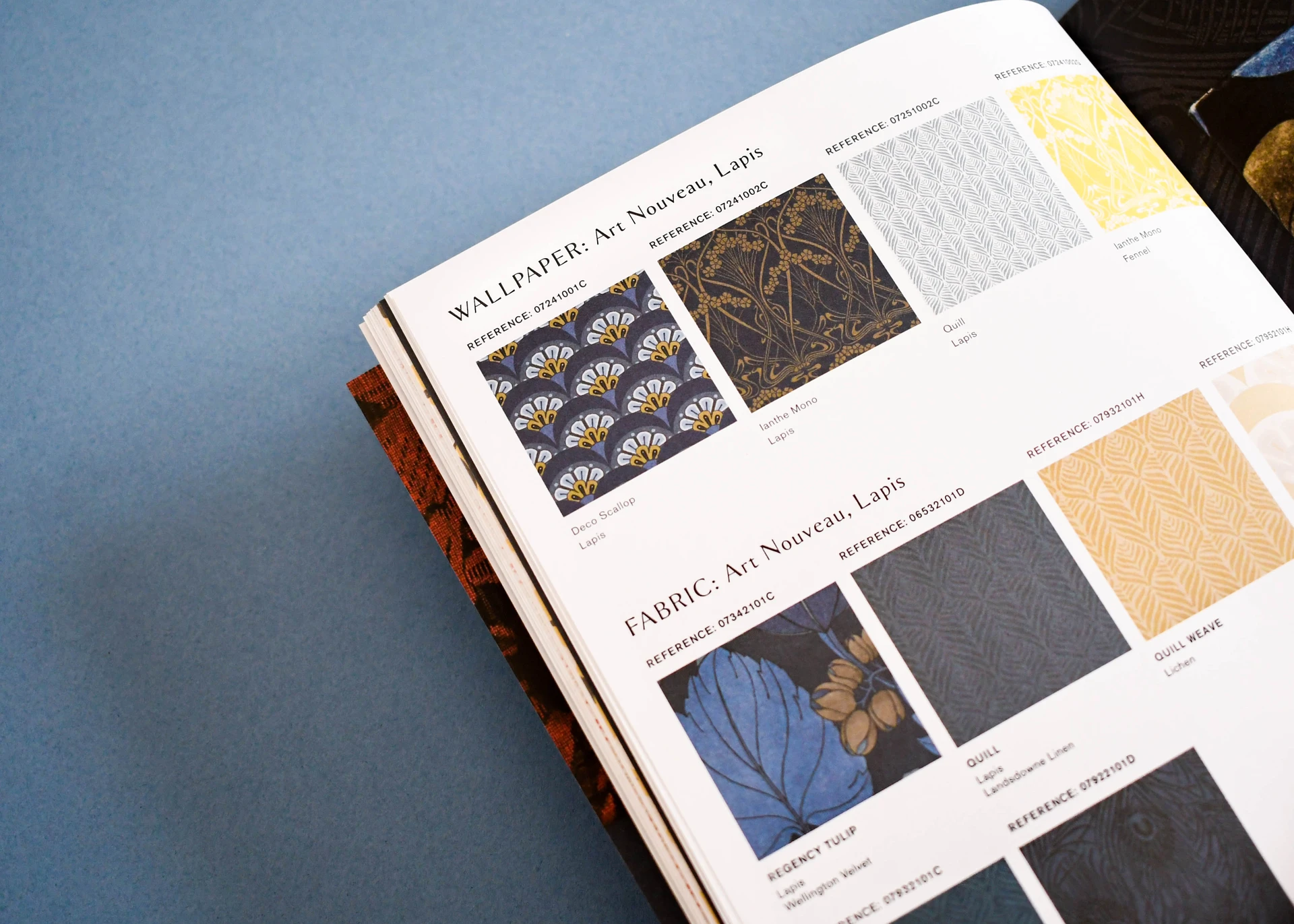 Close up of a swatch page with pattern names and reference codes printed beside each design.