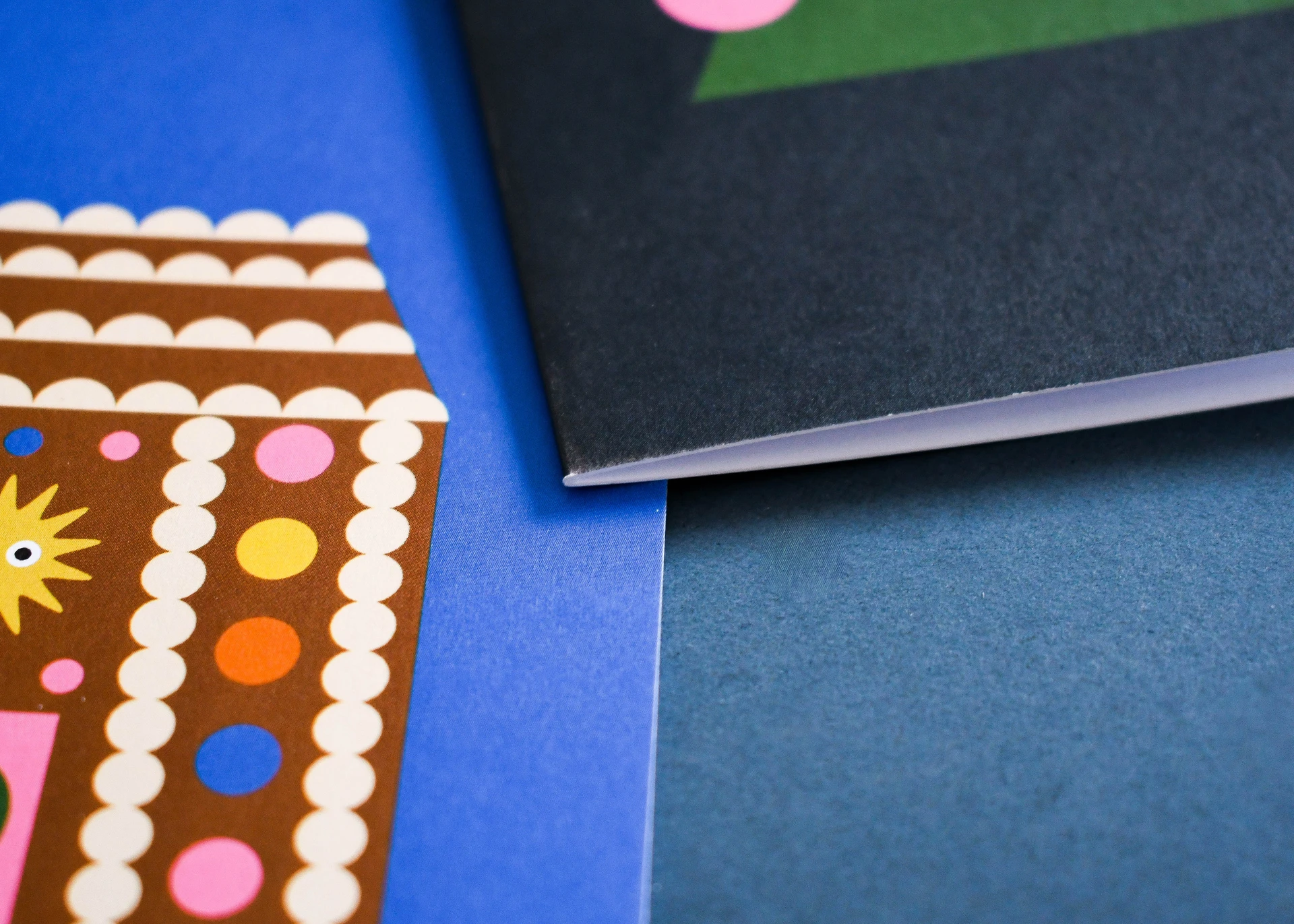 Close-up of two cards, one lifted to show the fold and the plain inside.